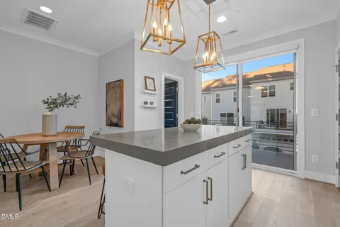 a kitchen with stainless steel appliances granite countertop a stove microwave and refrigerator