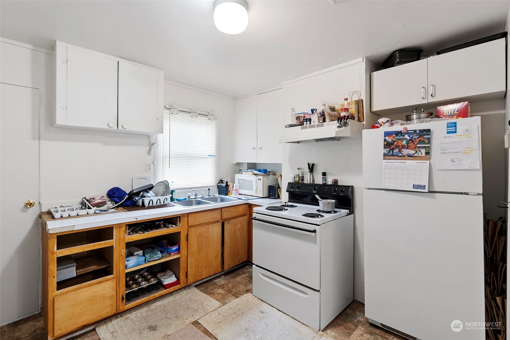 11726 Center Road Everett, WA 98204 - Photo 20 of 34 a kitchen with a refrigerator and a sink