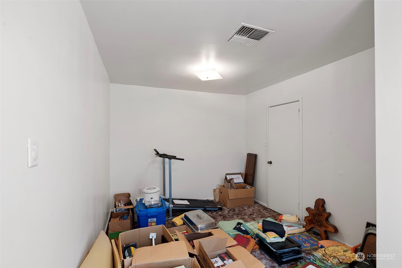 11726 Center Road Everett, WA 98204 - Photo 23 of 34 a room with furniture and gym equipment