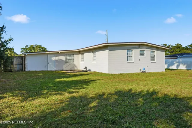 a view of a swimming pool with an outdoor space and seating area