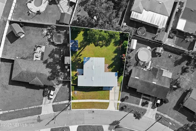 an aerial view of a highlighted house