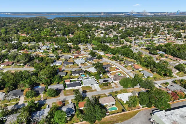 an aerial view of residential building and green space