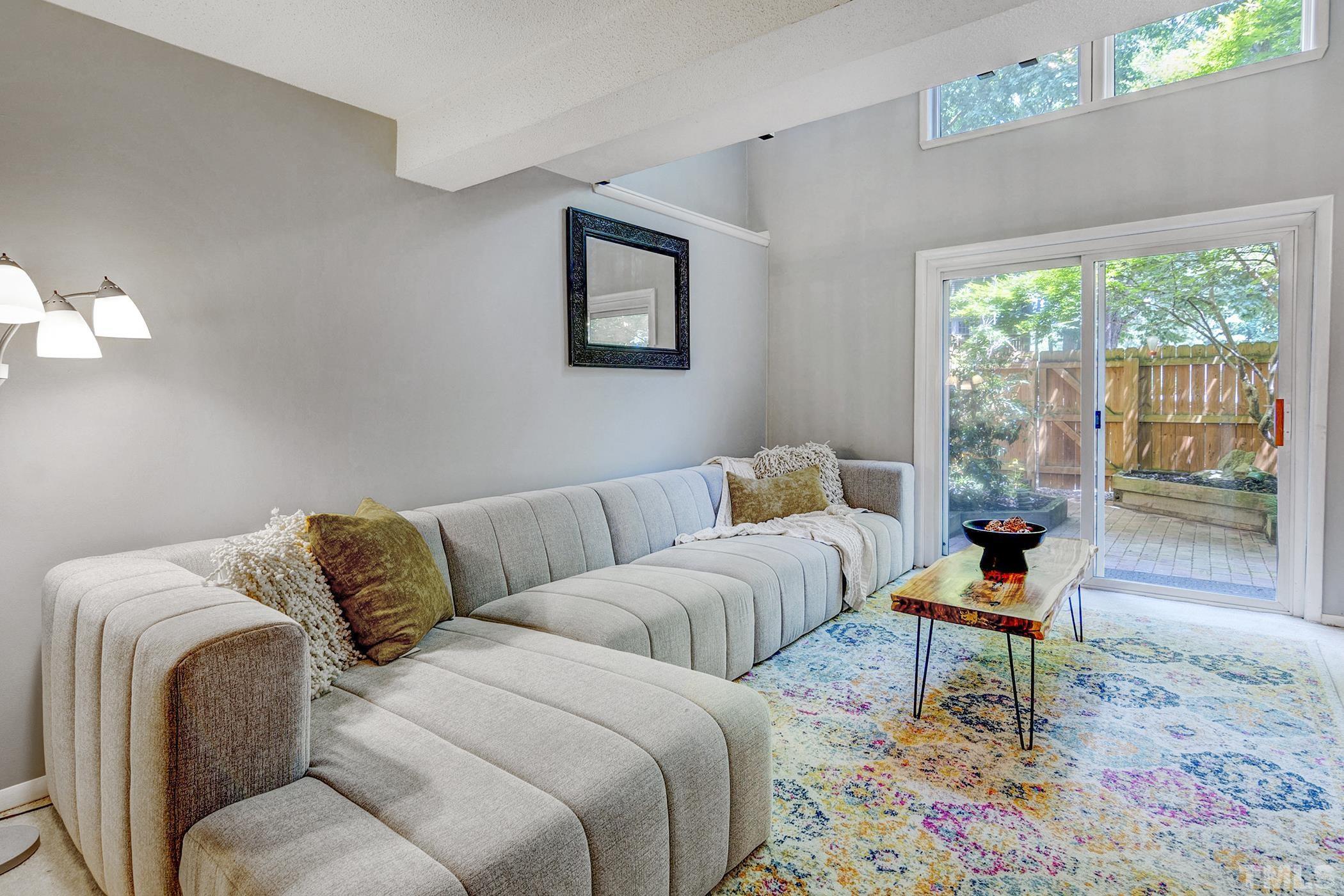 7706 Ohmann Court Raleigh, NC 27615 - Photo 22 of 27 a living room with furniture and a window