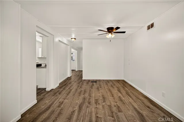 a kitchen with granite countertop a sink and cabinets