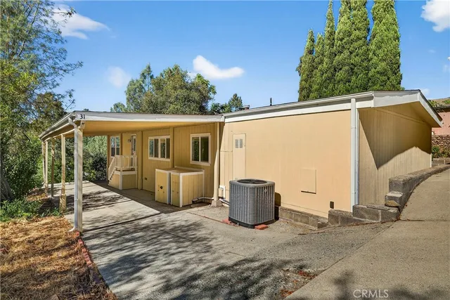 a front view of a house with parking space