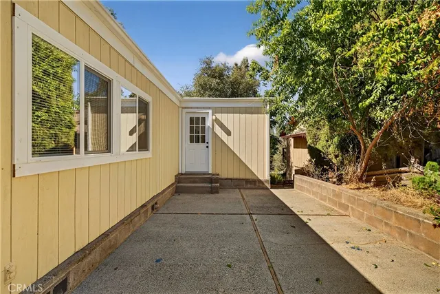 an aerial view of house with yard