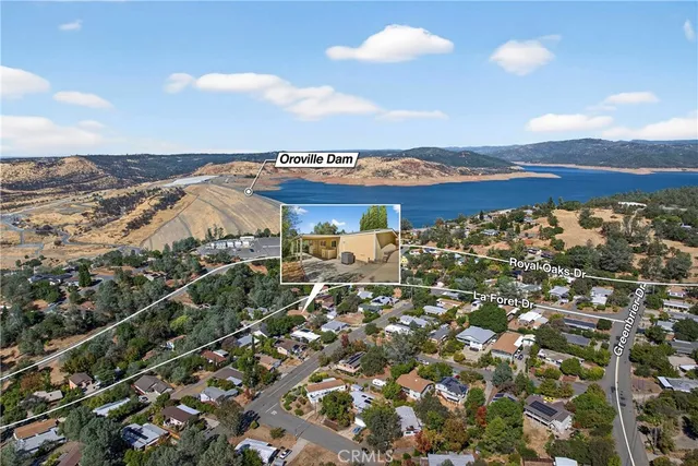 an aerial view of residential building with ocean view