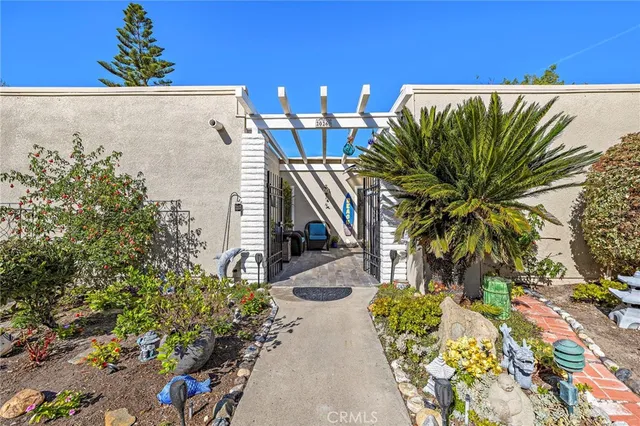 a view of a patio with table and chairs and potted plants