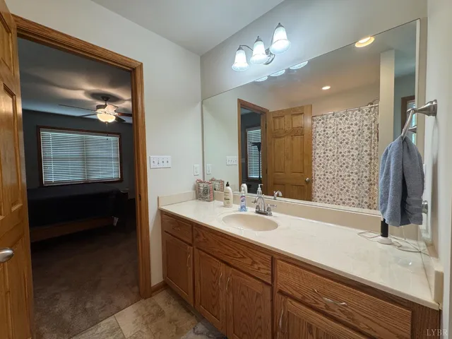 a bathroom with a sink double vanity and a mirror