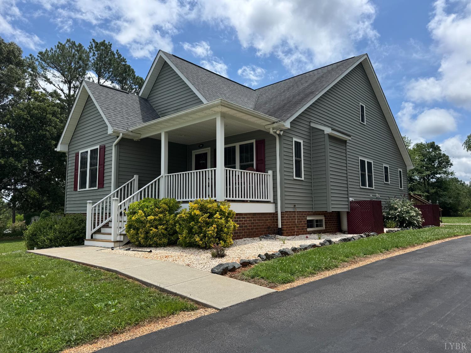 166 Dutch Lane Appomattox, VA 24522 - Photo 2 of 31 a front view of a house with a garden and plants