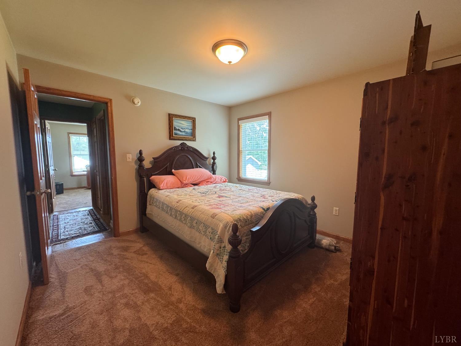 166 Dutch Lane Appomattox, VA 24522 - Photo 8 of 31 a bedroom with a bed and a mirror