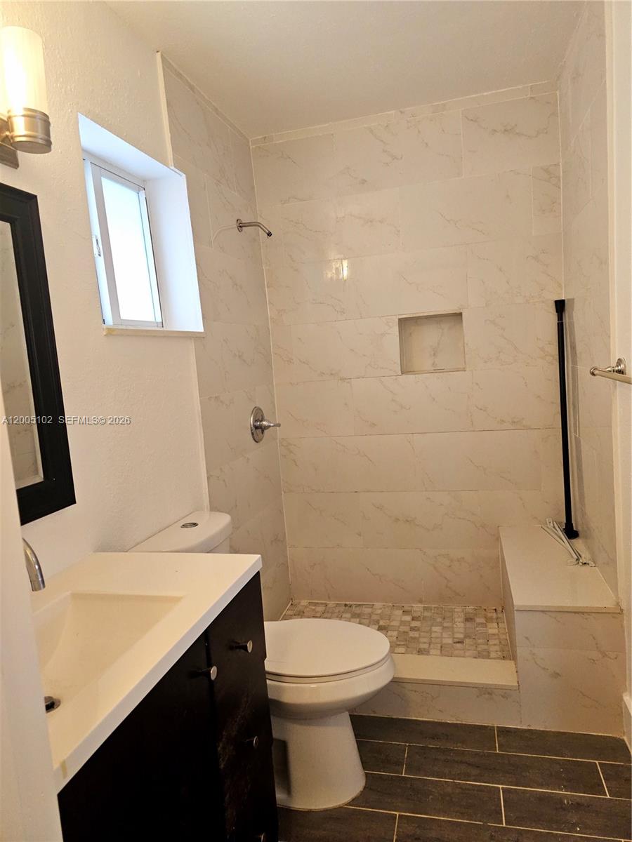 1736 Southwest 3rd Street, Unit 3 Miami, FL 33135 - Photo 6 of 10 a bathroom with a sink a toilet and shower