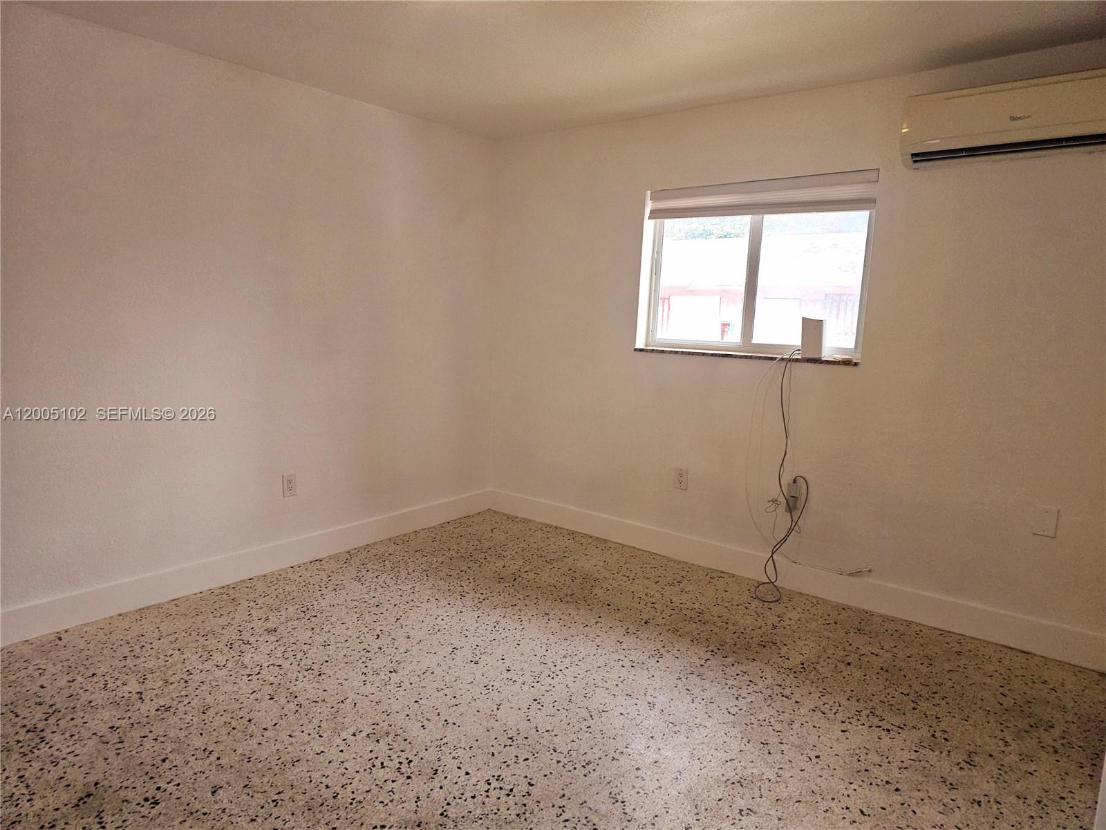 1736 Southwest 3rd Street, Unit 3 Miami, FL 33135 - Photo 8 of 10 a room that has a window in it