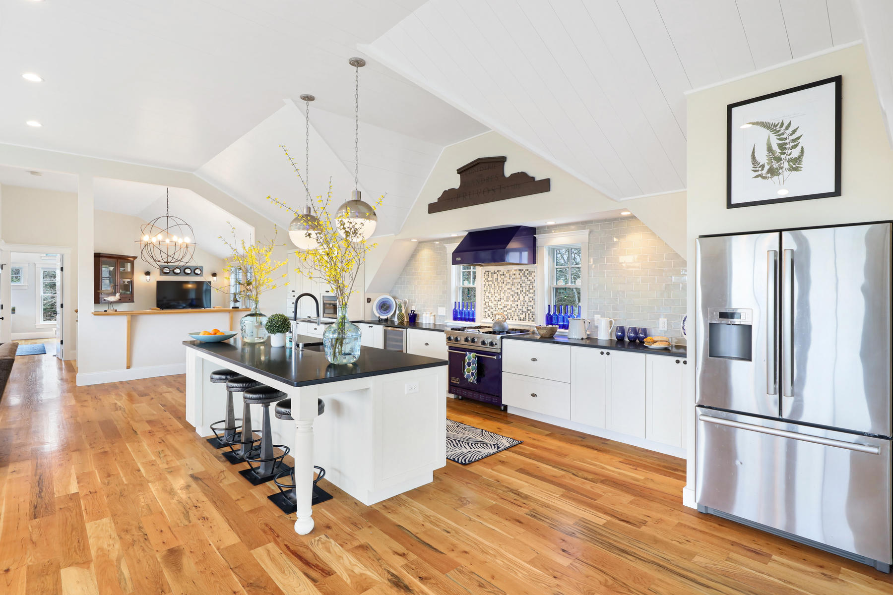 18 Snow Shore Road Orleans, MA 02653 - Photo 17 of 61 a kitchen with stainless steel appliances a stove a sink dishwasher and a refrigerator with wooden floor