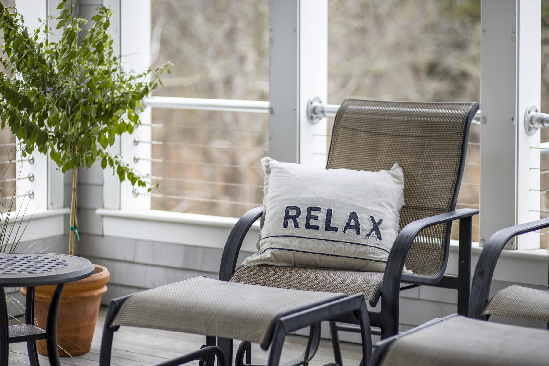 18 Snow Shore Road Orleans, MA 02653 - Photo 22 of 61 a view of a chairs and table in a balcony