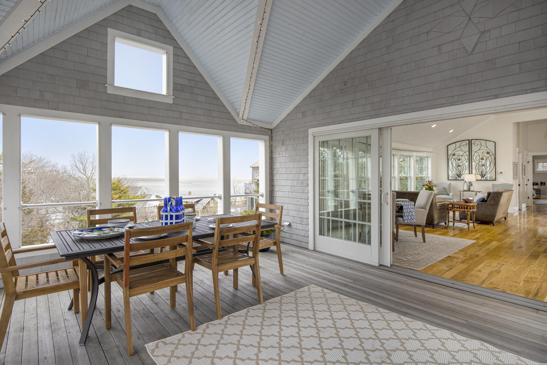 18 Snow Shore Road Orleans, MA 02653 - Photo 28 of 61 a room with lots of tables a large window and chairs