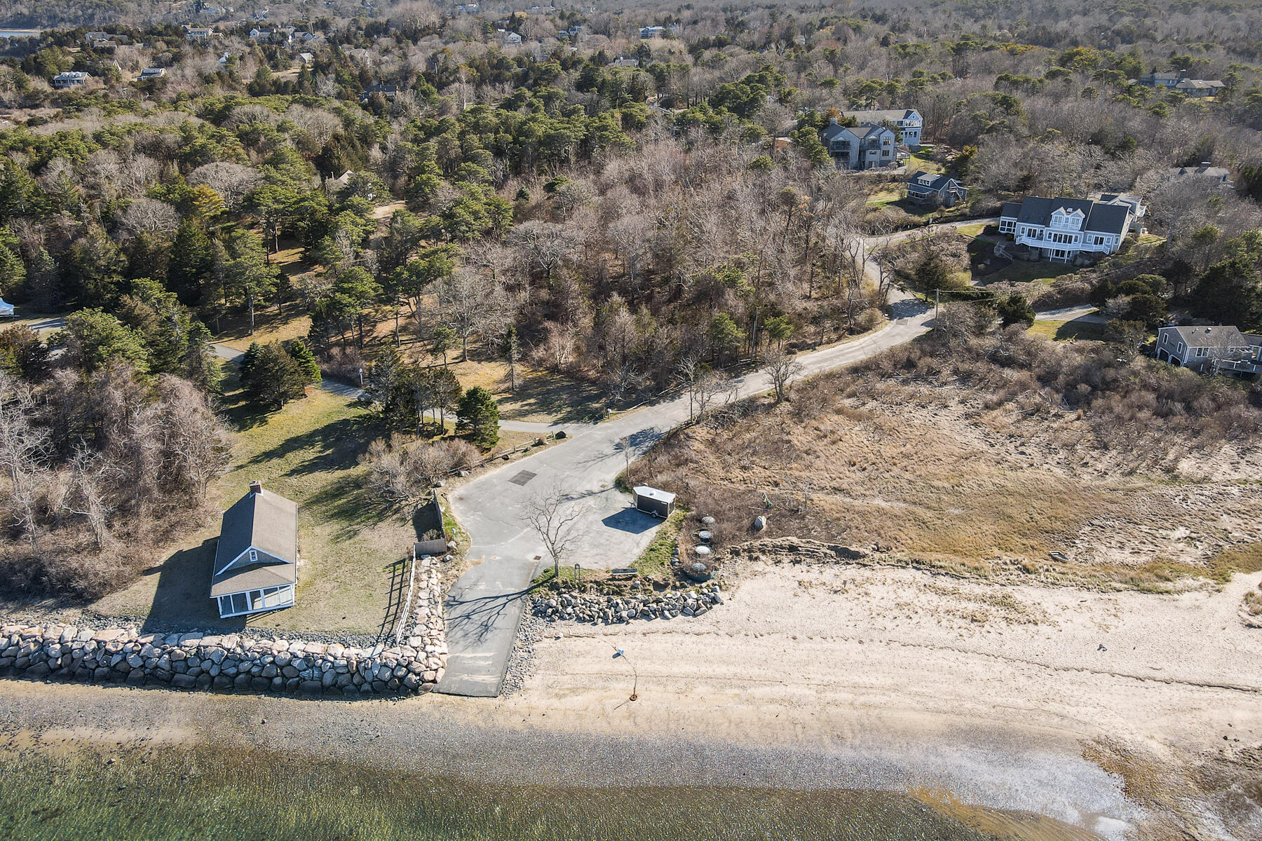 18 Snow Shore Road Orleans, MA 02653 - Photo 4 of 61 a view of a dry yard with wooden fence