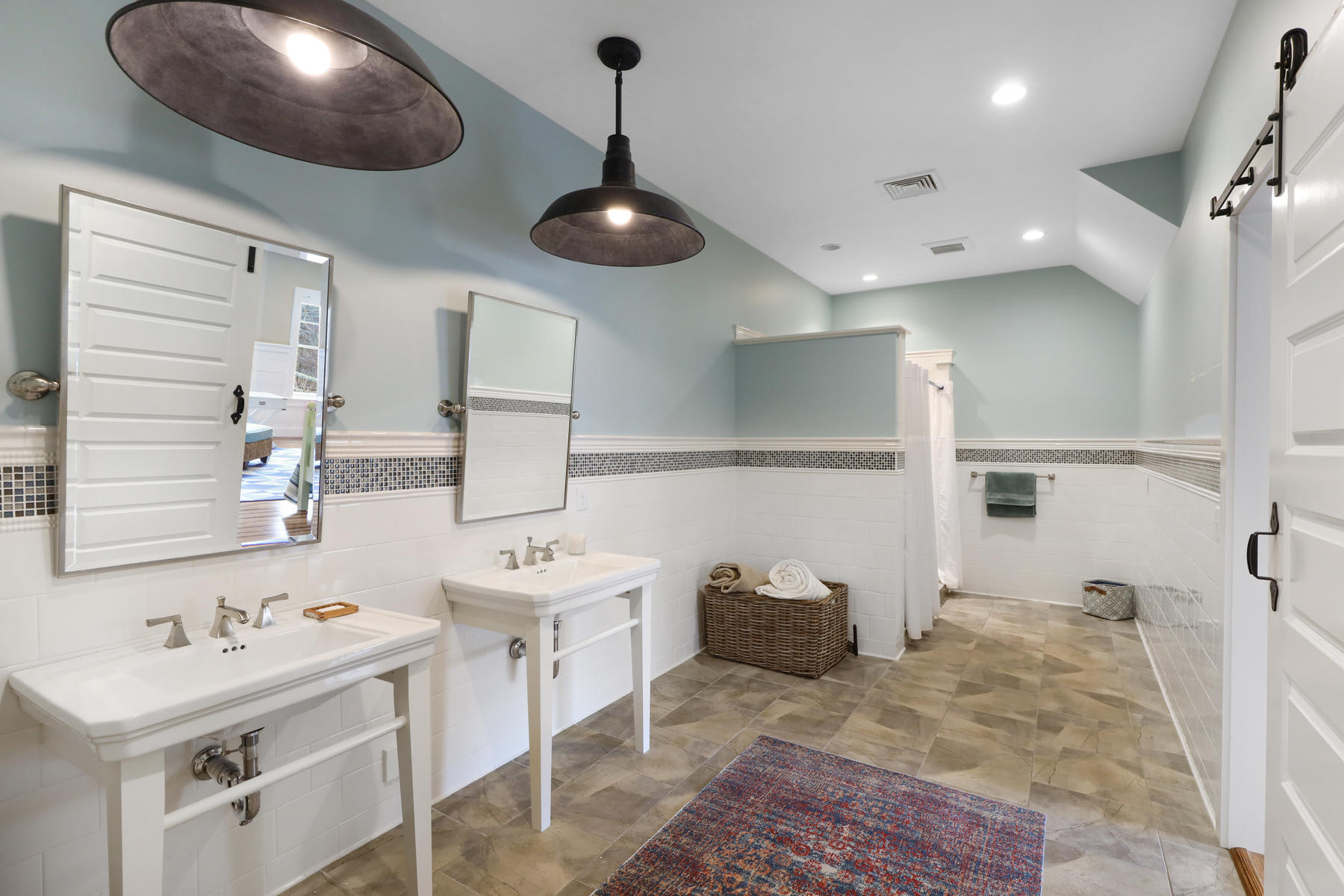 18 Snow Shore Road Orleans, MA 02653 - Photo 55 of 61 a bathroom with a sink a chandelier and a mirror
