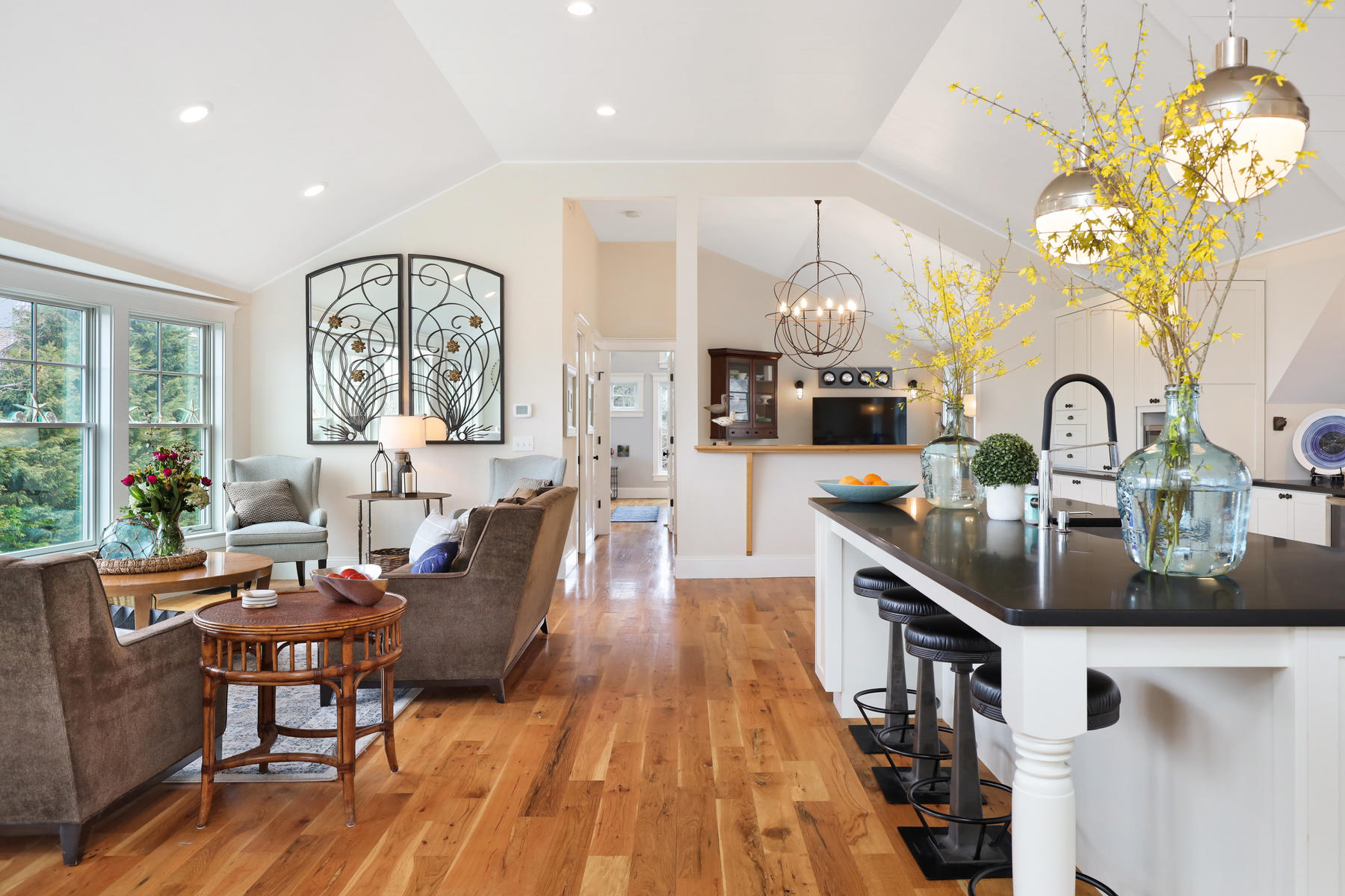 18 Snow Shore Road Orleans, MA 02653 - Photo 10 of 61 a dining room with wooden floor a chandelier a wooden table and chairs