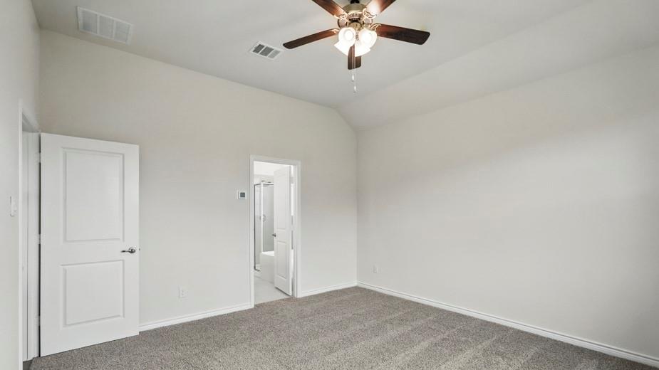 4162 Waldron Trail Forney, TX 75126 - Photo 16 of 29 Carpeted room with a vaulted ceiling, ceiling fan with integrated lighting, and white walls