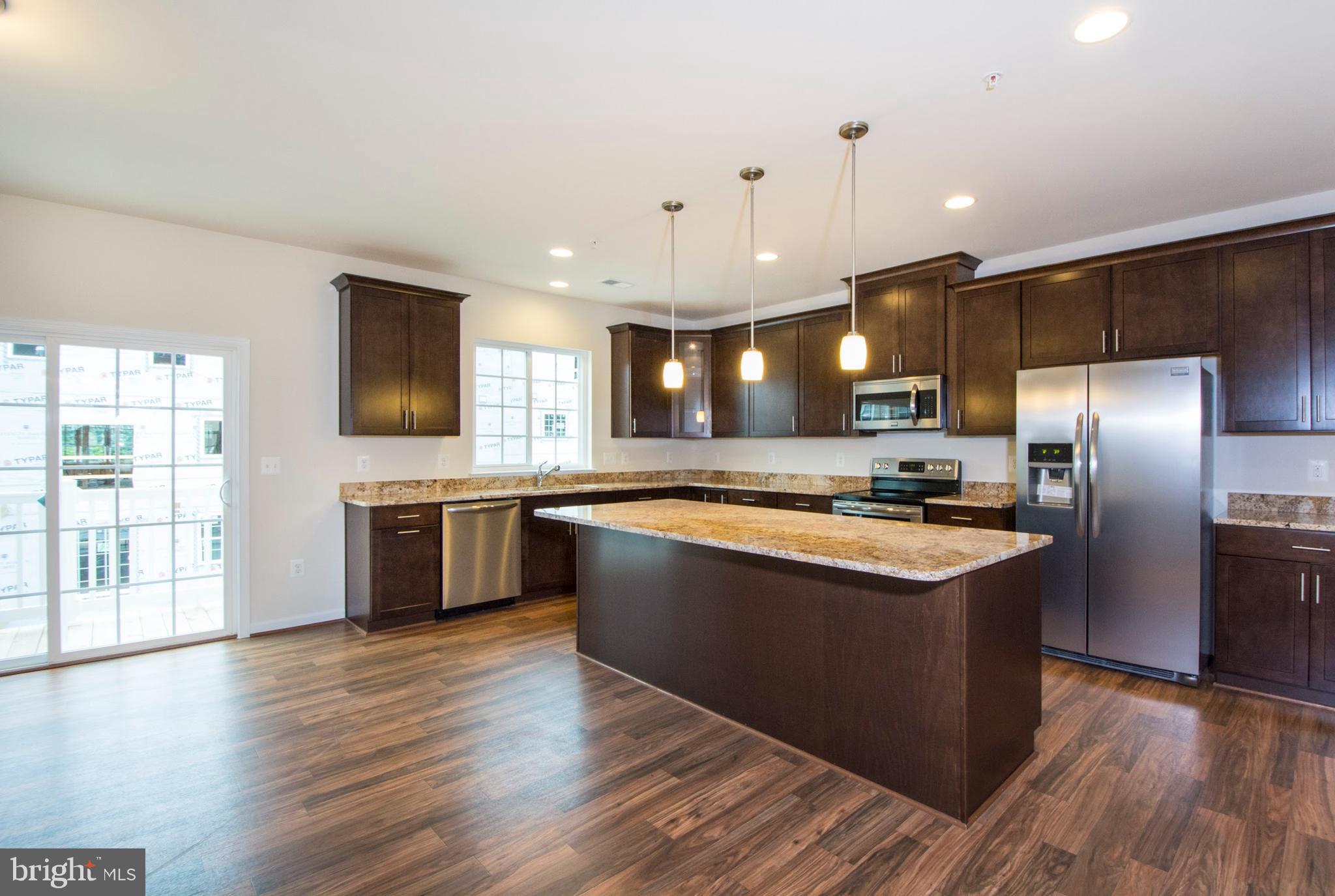 14894 Mason Creek Circle Woodbridge, VA 22191 - Photo 2 of 25 a large kitchen with stainless steel appliances granite countertop a stove a sink dishwasher a refrigerator and a flat screen tv