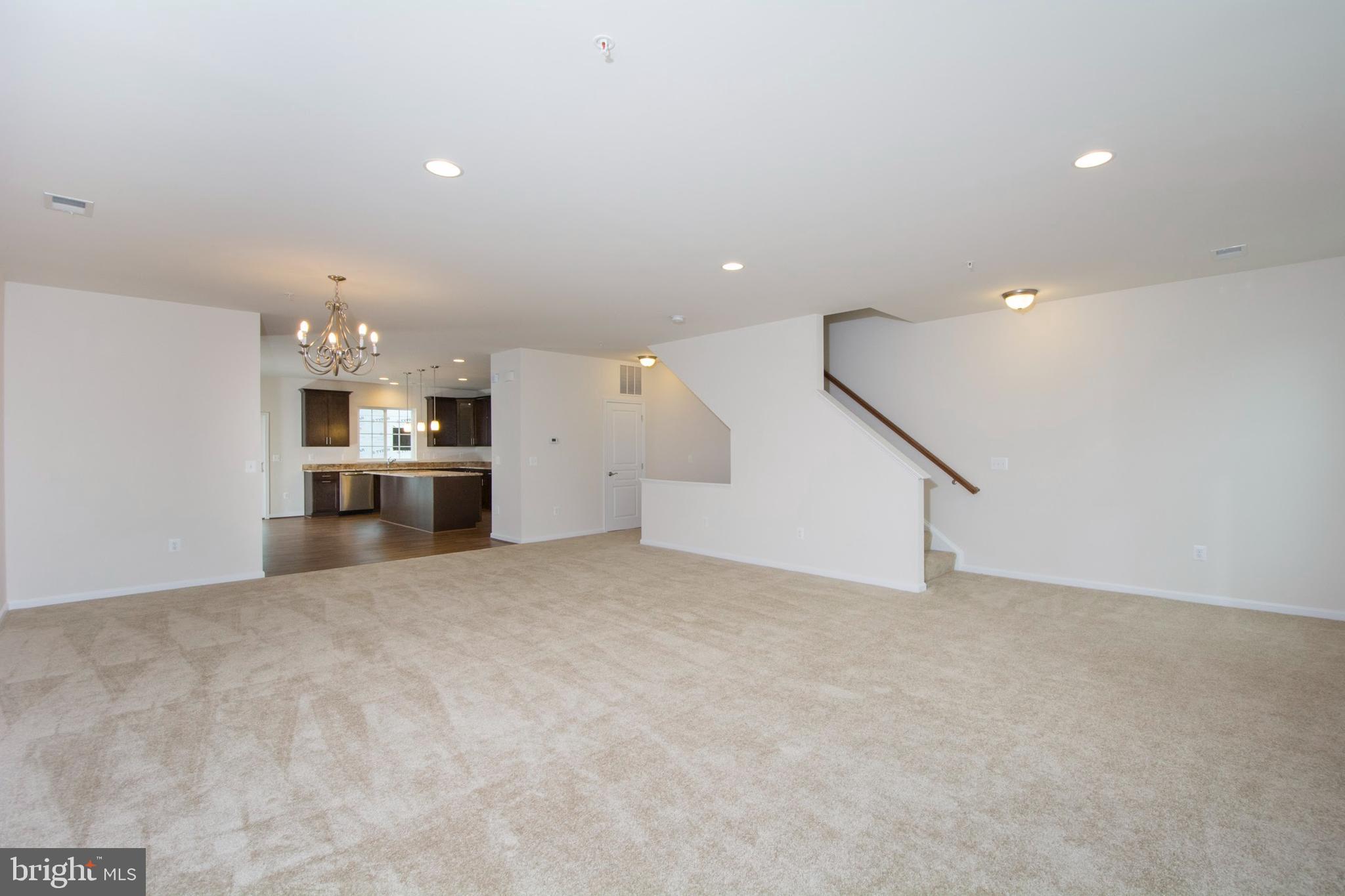 14894 Mason Creek Circle Woodbridge, VA 22191 - Photo 10 of 25 a view of an empty room with a kitchen