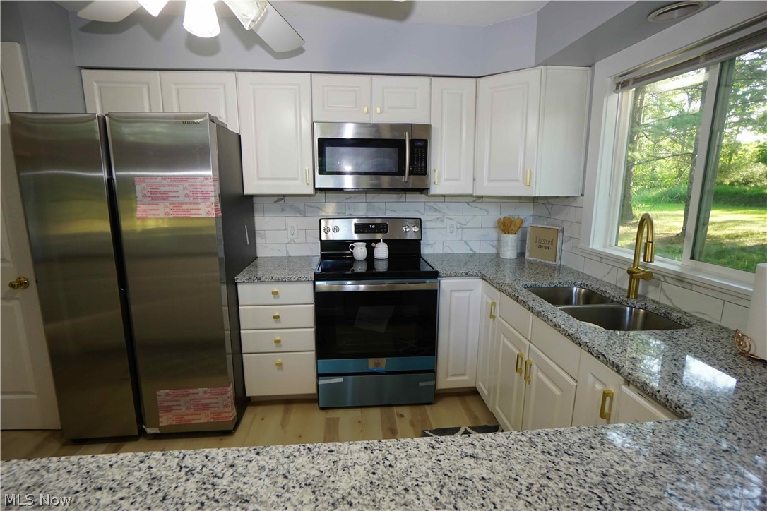 14543 Ensign Road Burton, OH 44021 - Photo 10 of 32 Kitchen with granite countertops