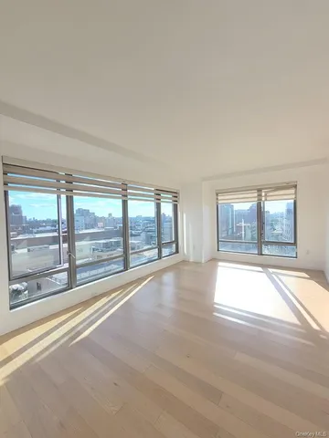 a bathroom with a bathtub toilet mirror and sink