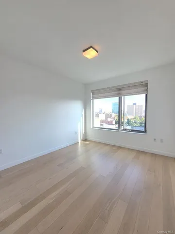 a bathroom with a bathtub shower sink mirror and toilet