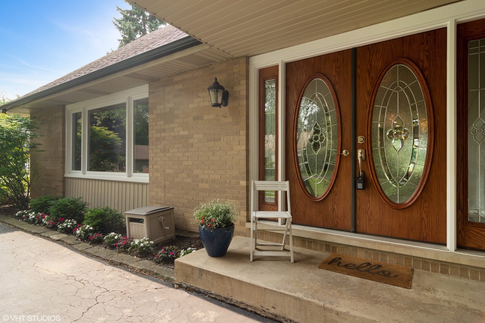 4 Burning Tree Road Rolling Meadows, IL 60008 - Photo 2 of 31 a group of potted plants sitting in front of a door