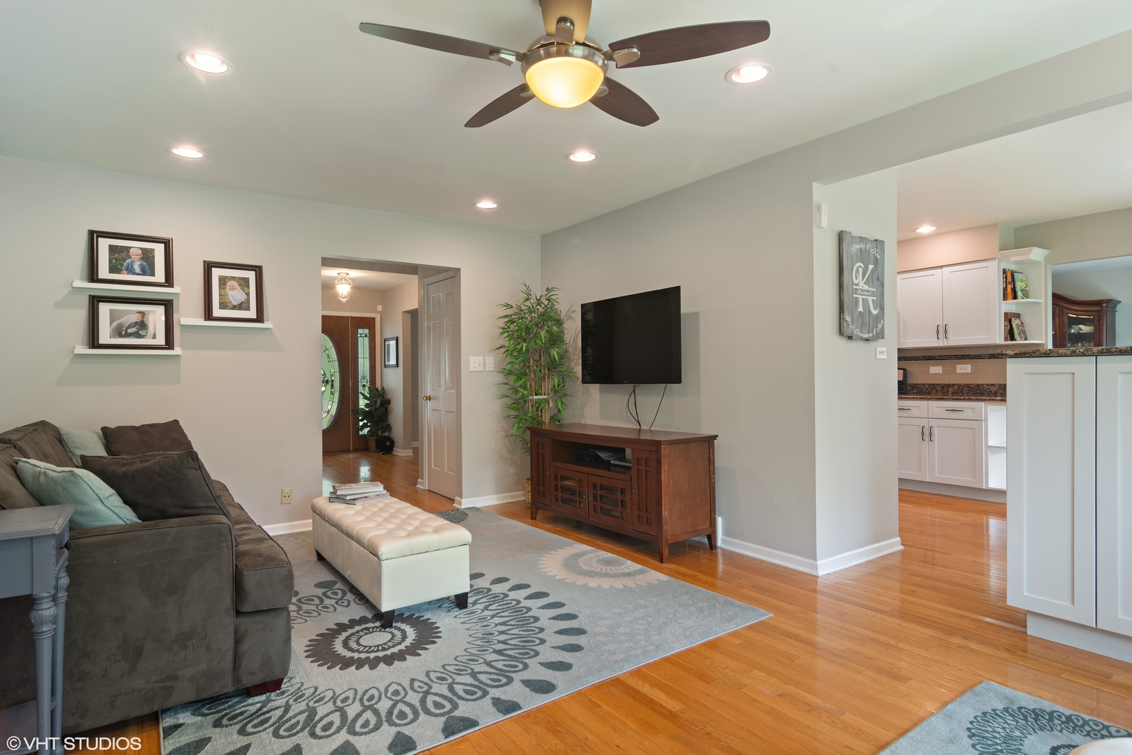 4 Burning Tree Road Rolling Meadows, IL 60008 - Photo 11 of 31 a living room with furniture and a flat screen tv