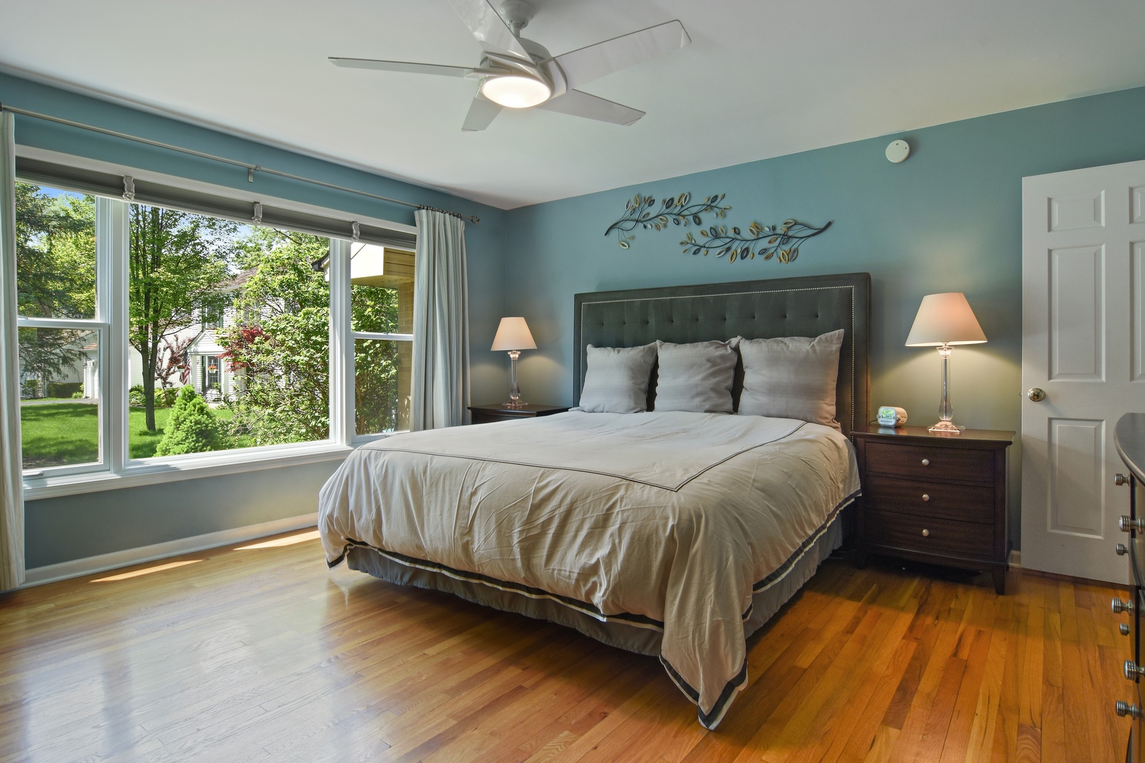 4 Burning Tree Road Rolling Meadows, IL 60008 - Photo 16 of 31 a spacious bedroom with a bed and a large window