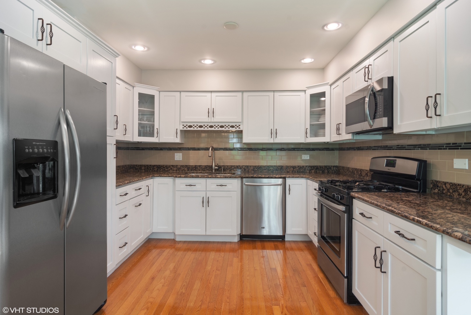 4 Burning Tree Road Rolling Meadows, IL 60008 - Photo 6 of 31 a kitchen with stainless steel appliances granite countertop a stove a sink and a refrigerator