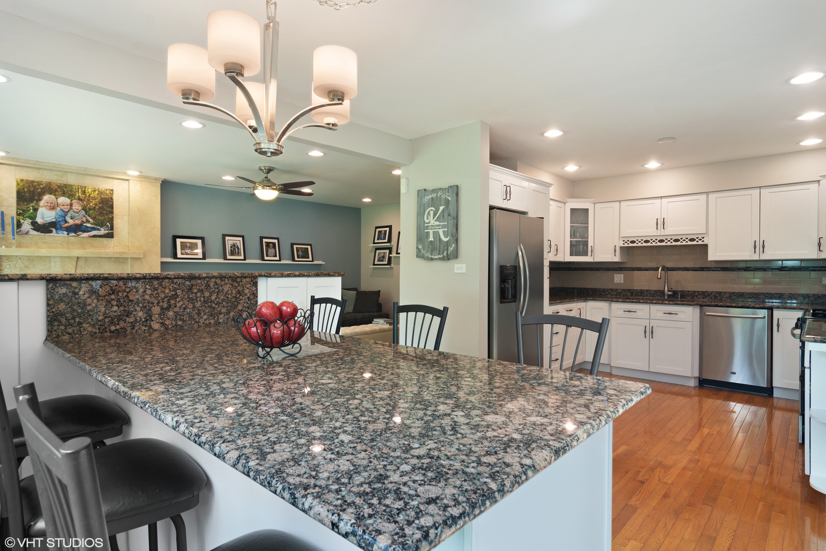 4 Burning Tree Road Rolling Meadows, IL 60008 - Photo 7 of 31 a kitchen with stainless steel appliances kitchen island granite countertop a stove and cabinets