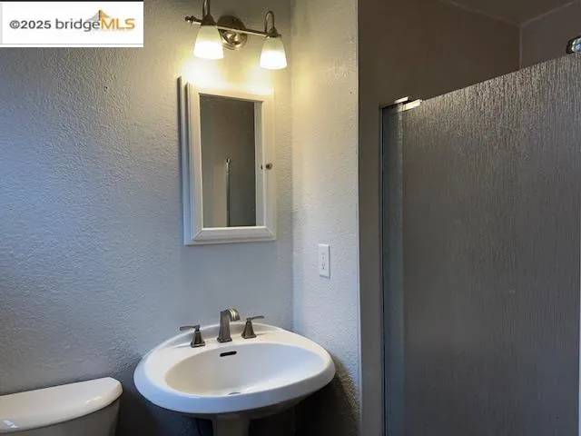 a bathroom with a sink and mirror