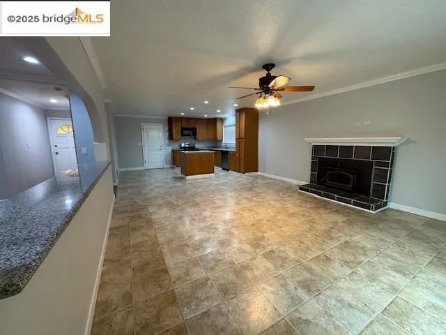 a view of a livingroom with a fireplace and a chandelier