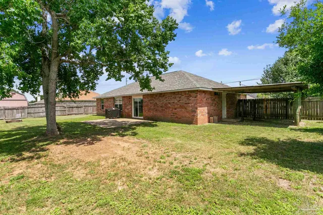 a swimming pool with wooden fence