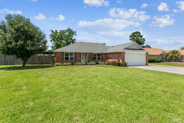 a view of a house with a big yard