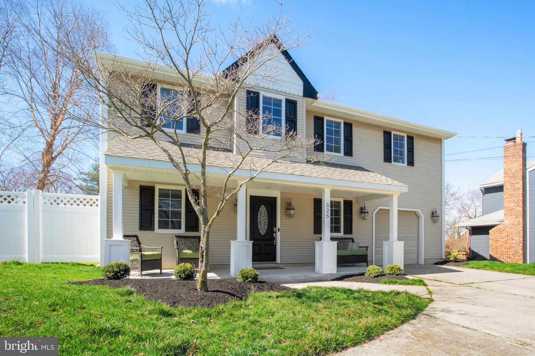 525 Coles Mill Road Haddonfield, NJ 08033 - Photo 2 of 36 a front view of a house with a yard and plants