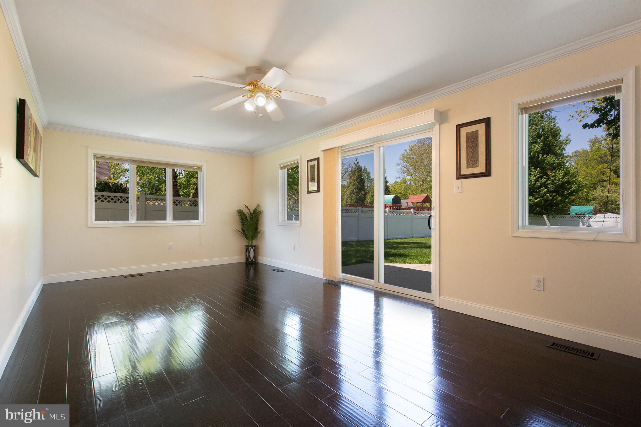 525 Coles Mill Road Haddonfield, NJ 08033 - Photo 13 of 36 a view of an empty room with wooden floor and a window