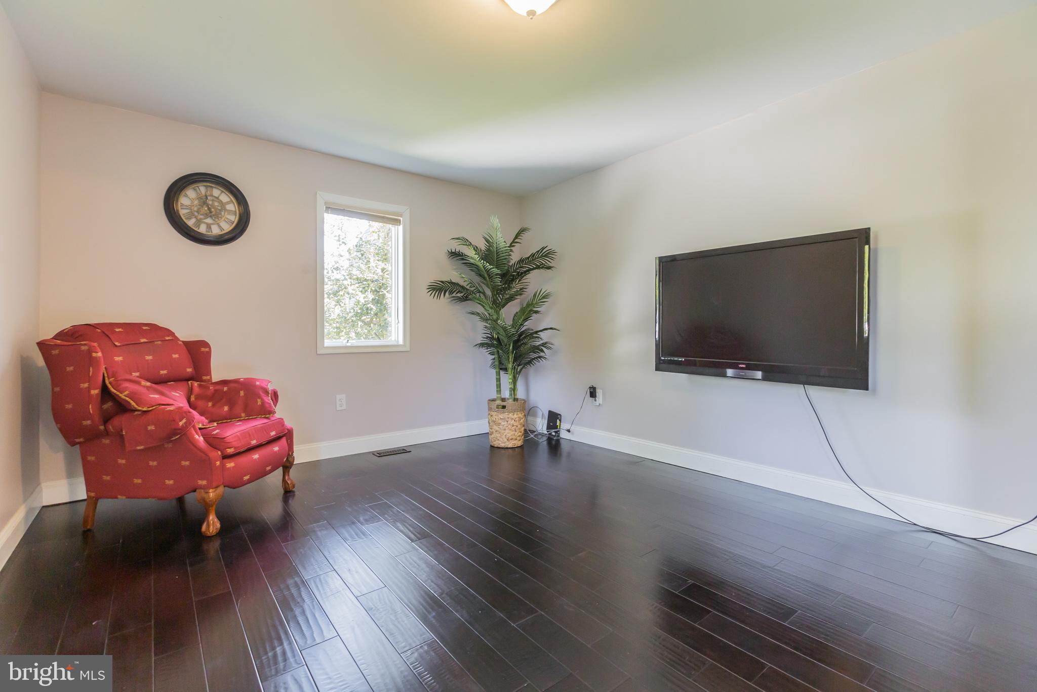 525 Coles Mill Road Haddonfield, NJ 08033 - Photo 15 of 36 a living room with furniture and a flat screen tv