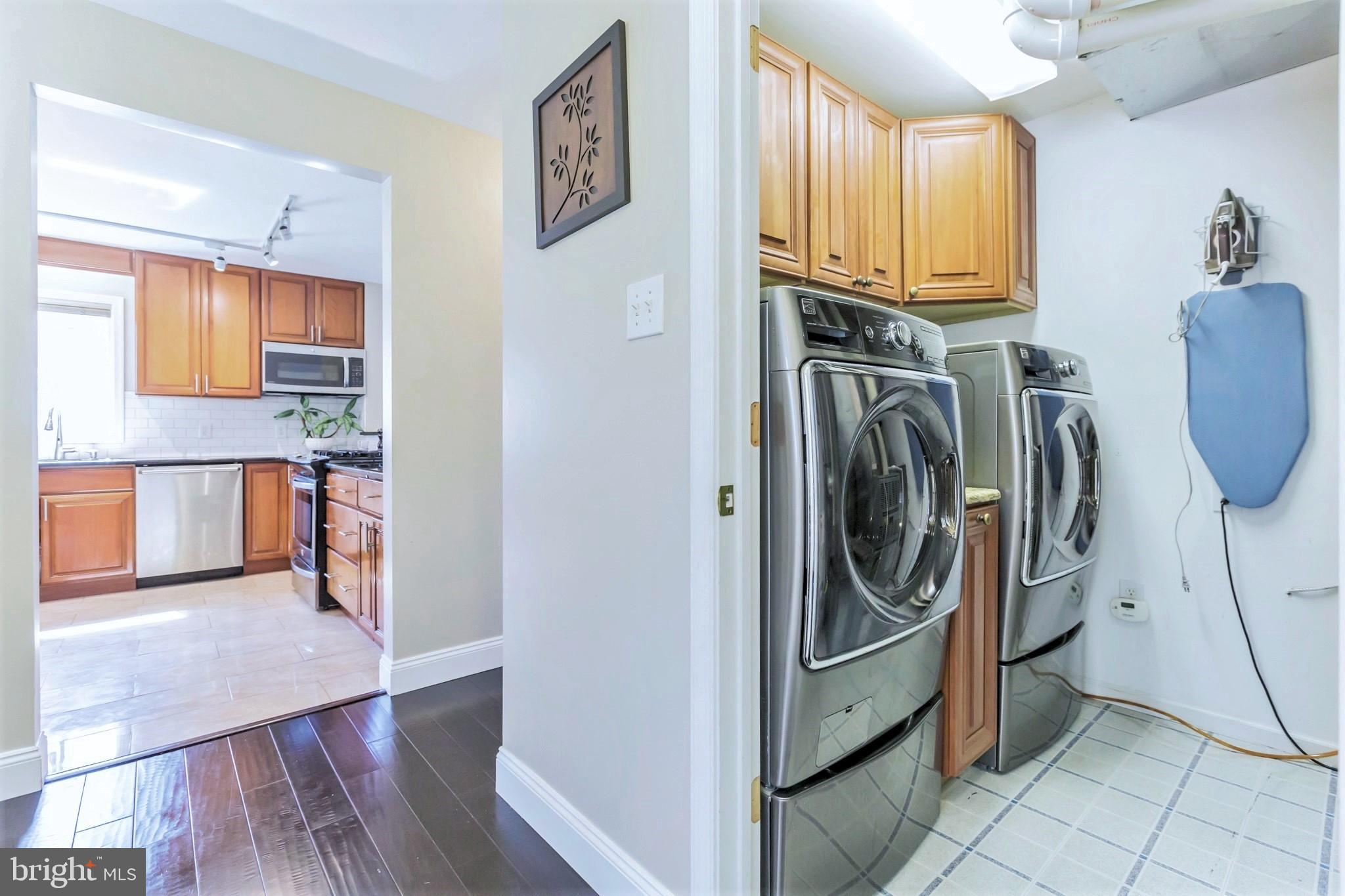 525 Coles Mill Road Haddonfield, NJ 08033 - Photo 17 of 36 a view of a kitchen with fridge and wooden floor