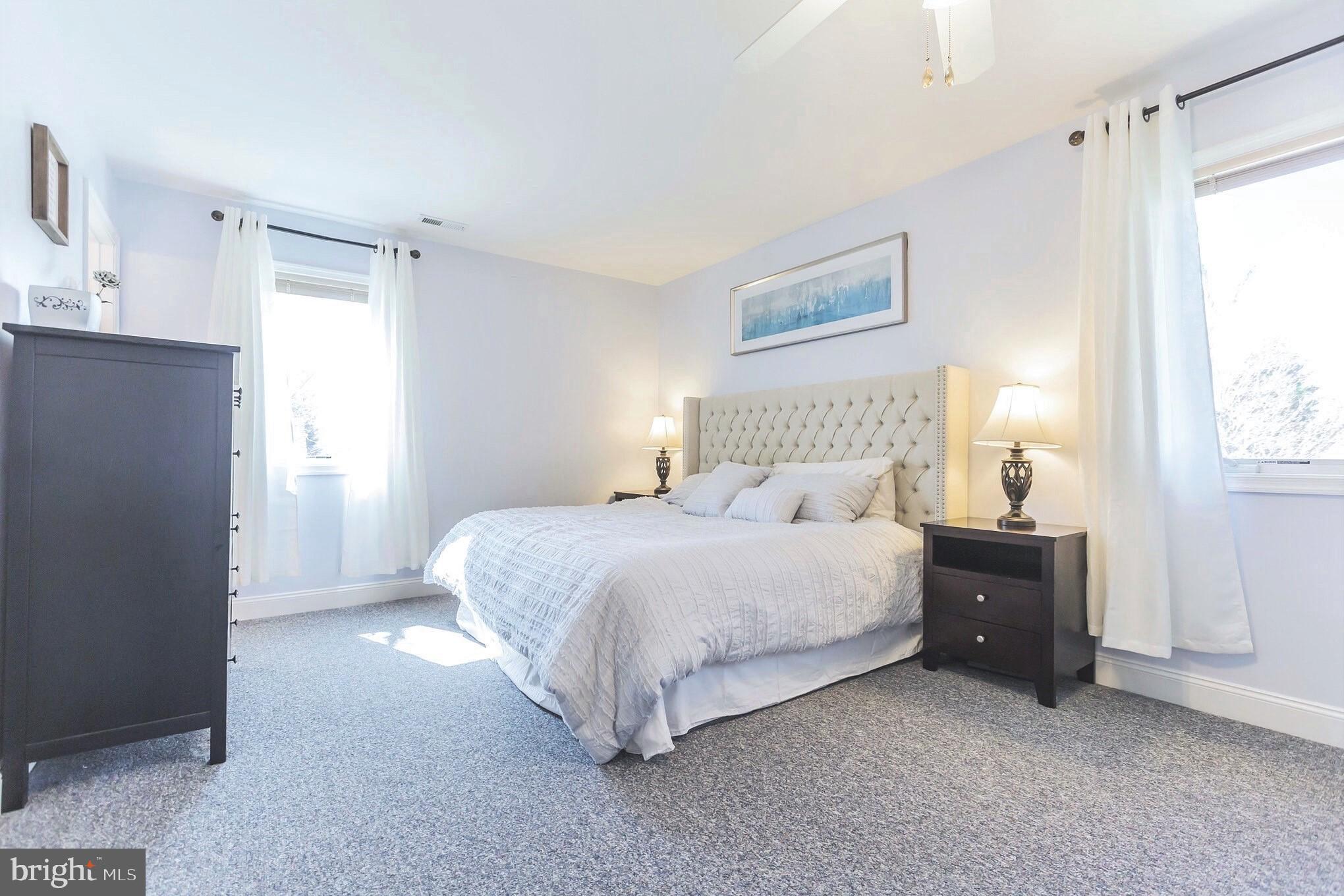 525 Coles Mill Road Haddonfield, NJ 08033 - Photo 18 of 36 a bedroom with a bed and a window