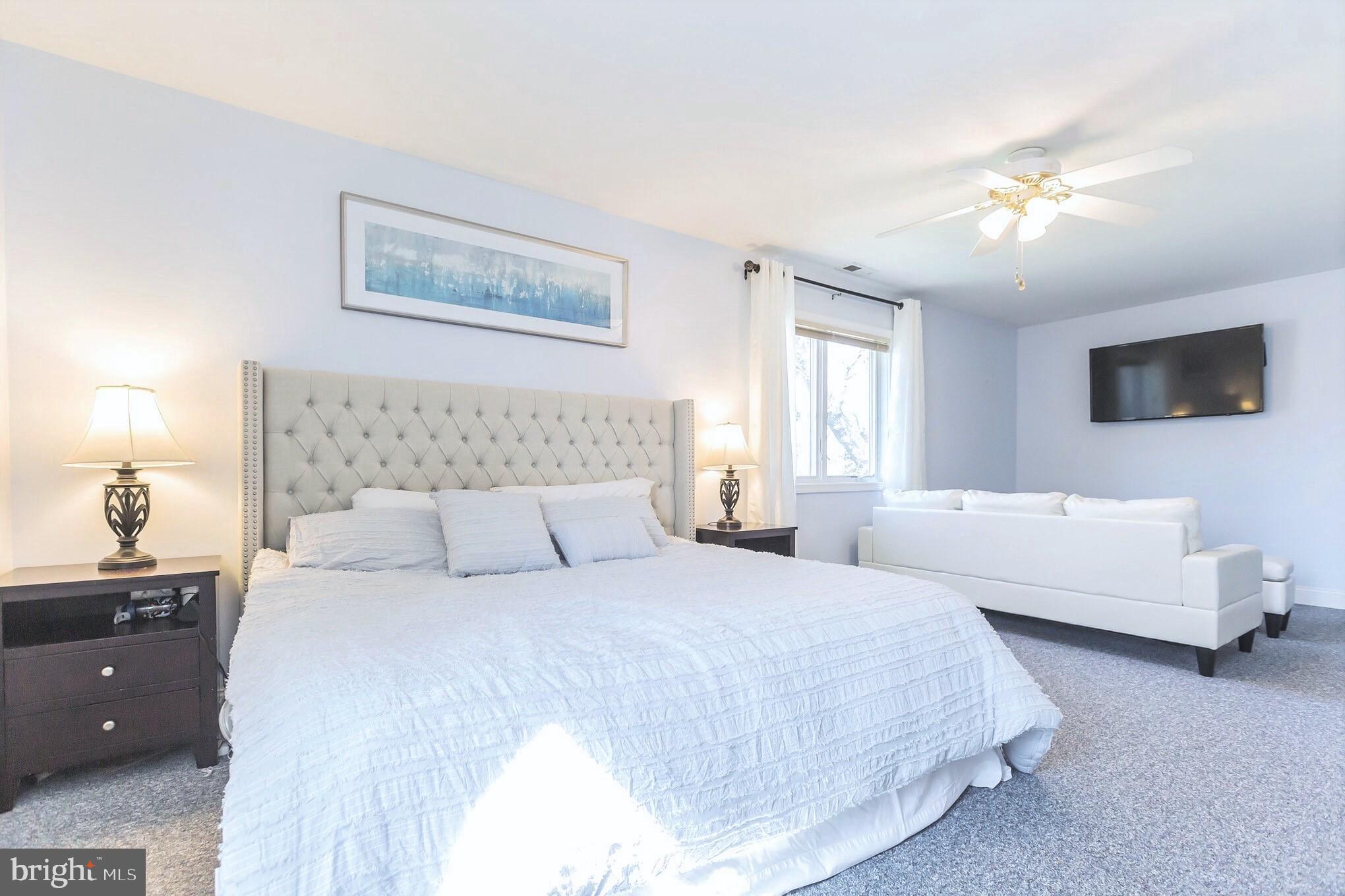 525 Coles Mill Road Haddonfield, NJ 08033 - Photo 20 of 36 a bedroom with a bed and a couch