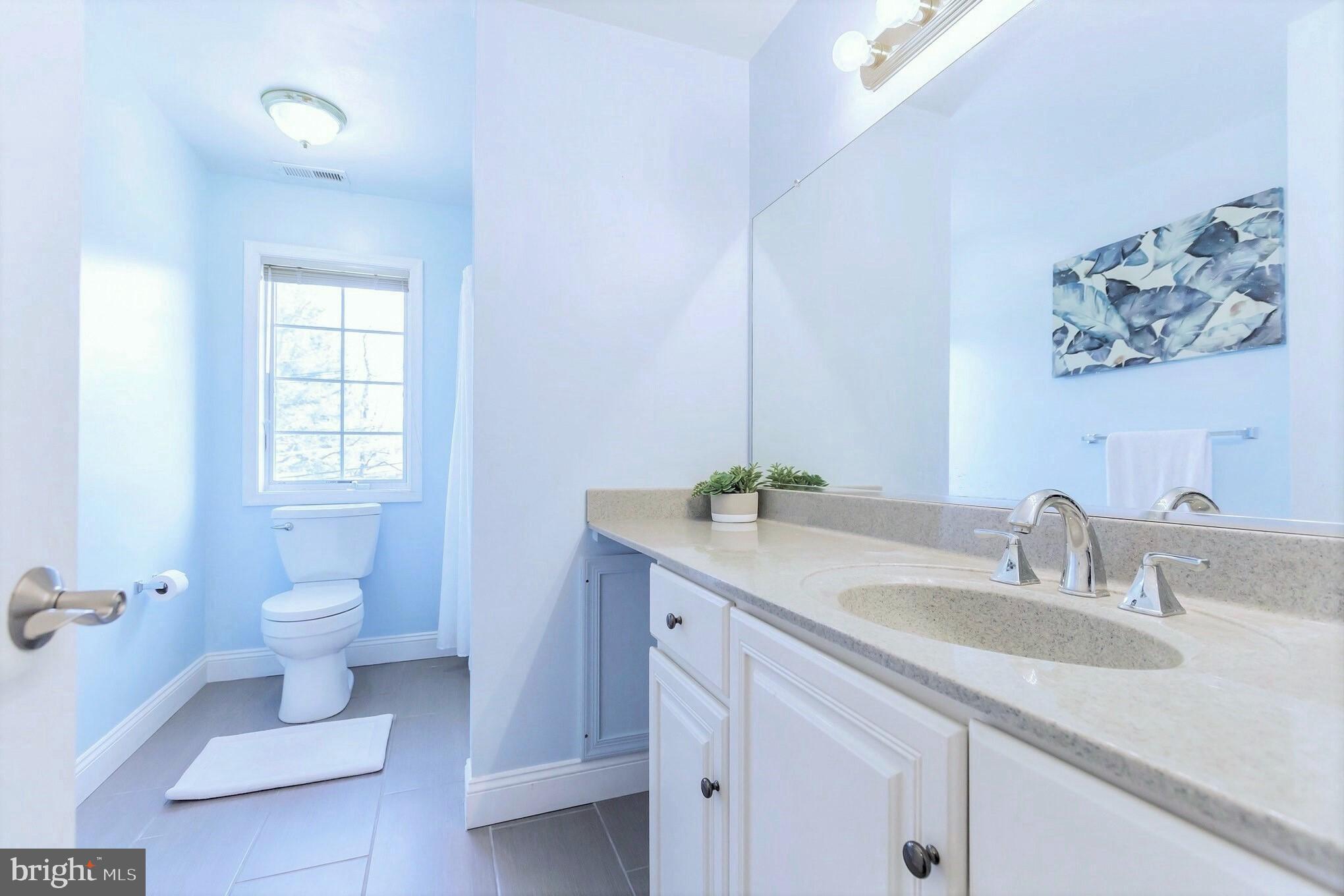 525 Coles Mill Road Haddonfield, NJ 08033 - Photo 29 of 36 a bathroom with a granite countertop sink toilet and a mirror