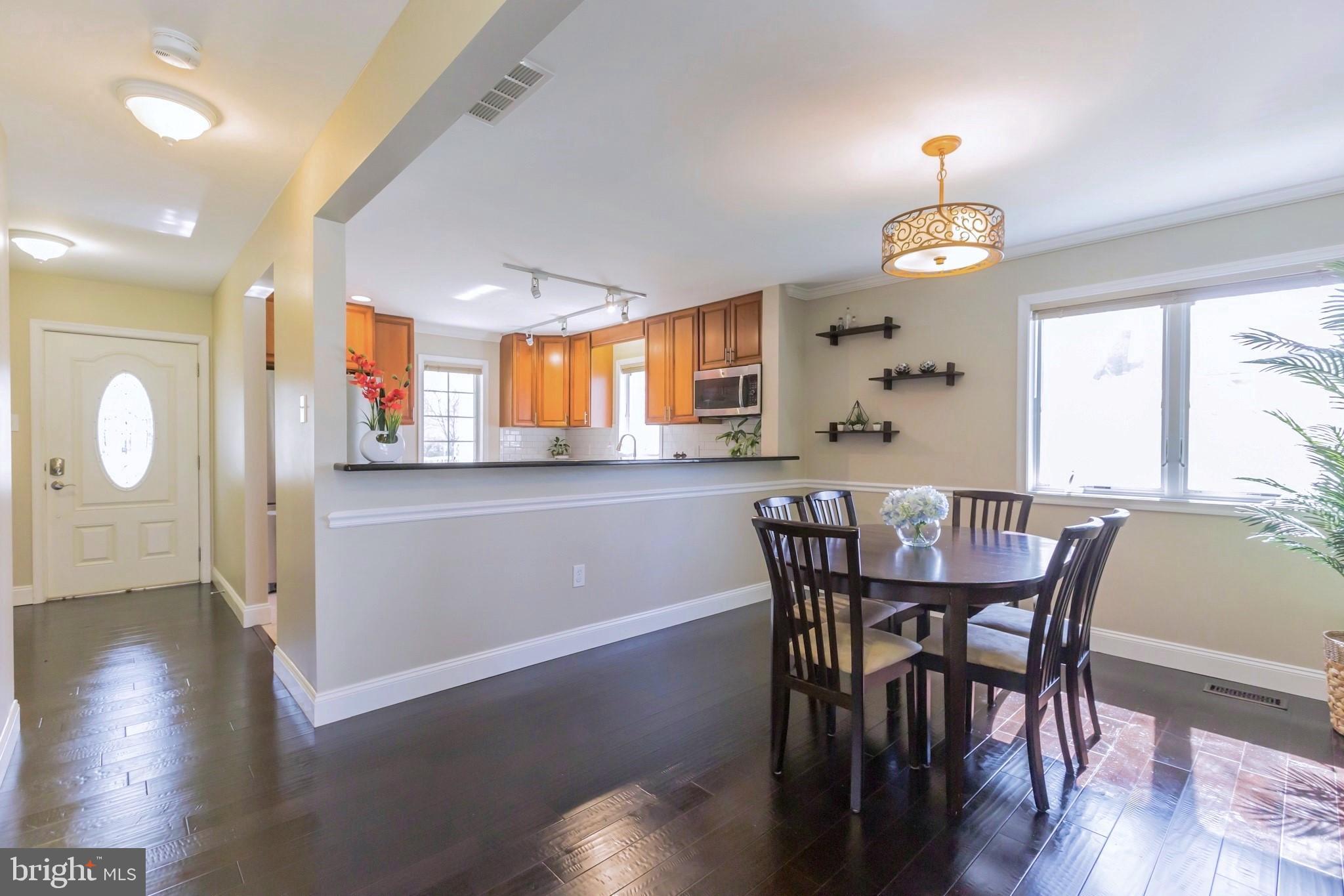 525 Coles Mill Road Haddonfield, NJ 08033 - Photo 7 of 36 a view of a dining room with furniture and wooden floor