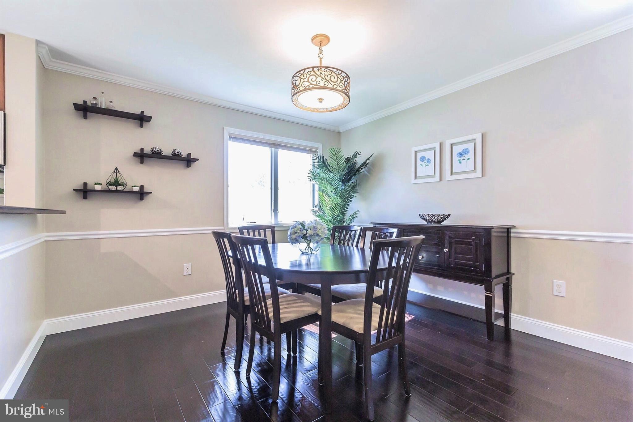 525 Coles Mill Road Haddonfield, NJ 08033 - Photo 8 of 36 a view of a dining room with furniture and wooden floor