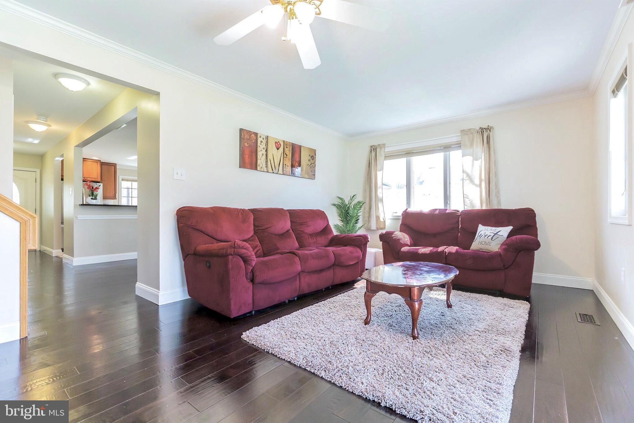 525 Coles Mill Road Haddonfield, NJ 08033 - Photo 9 of 36 a living room with furniture and a rug