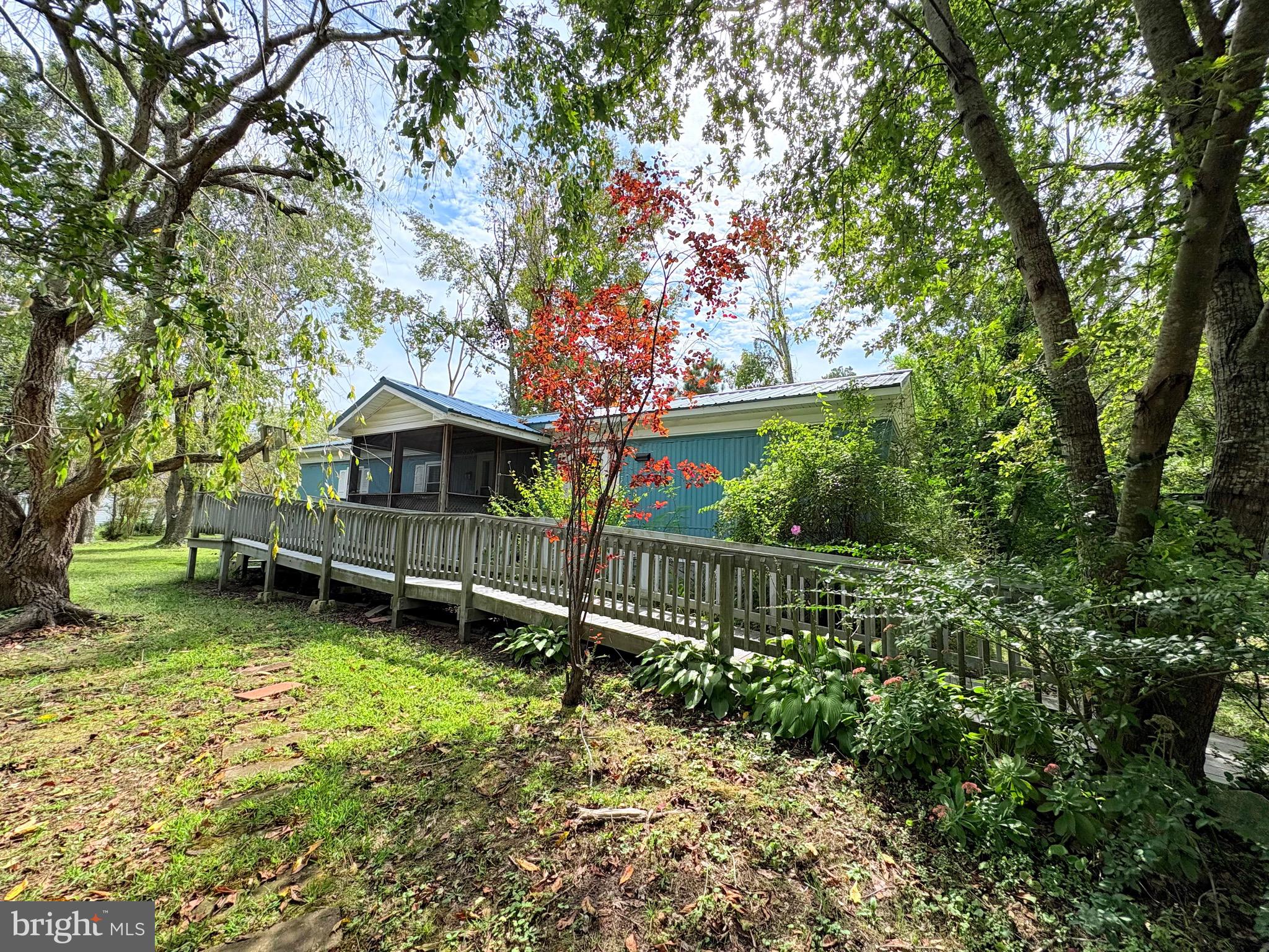 a front view of a house with a yard table and chairs