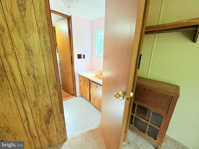 a bathroom with a sink and washing machine
